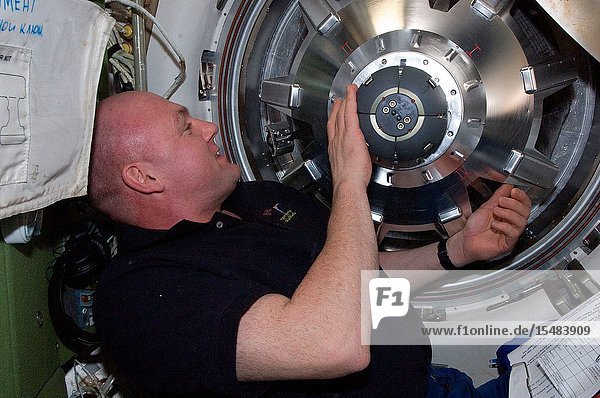 European Space Agency astronaut Andre Kuipers  Expedition 30 flight engineer  prepares to open the hatch in the Zvezda Service Module transfer tunnelATV vestibule of the International Space Station after ESA's Edoardo Amaldi Automated Transfer Vehicle-3 (ATV-3) docked with the station.