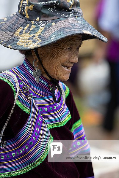 Flowers Hmong (hill tribe) woman at the sunday market Bac Ha Lao Cai Province Vietnam Asia.