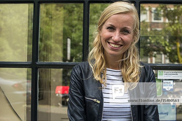 Utrecht Netherlands. Young lesbian woman outside the local lgbt hangout.