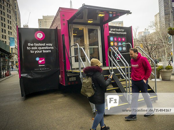 The Klaxoon Teamwork Across America Tour truck in Flatiron Plaza in New York on Monday February 18 2018. The hot-pink semi truck demonstrates how the software Klaxoon functions in promoting collaborative teamwork amongst employees. Klaxoon has offices in Rennes France and Brooklyn and last year received a $50 million round of funding. (© Richard B. Levine).