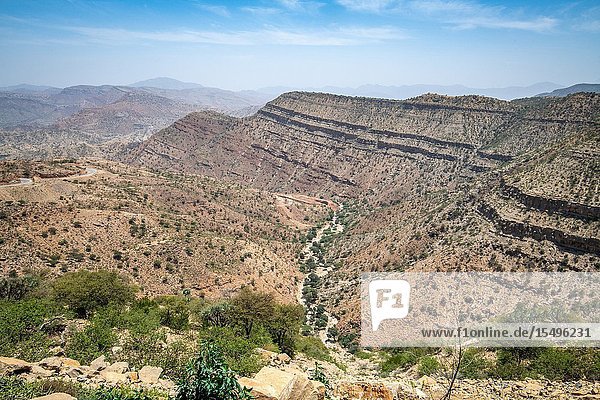 The rock and shrub covered mountains and valleys of the Danakil Depression Ethiopia.