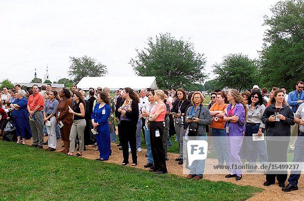 Friends and co-workers of the STS-107 crew members look on during tree planting ceremonies at the Johnson Space Center (JSC).