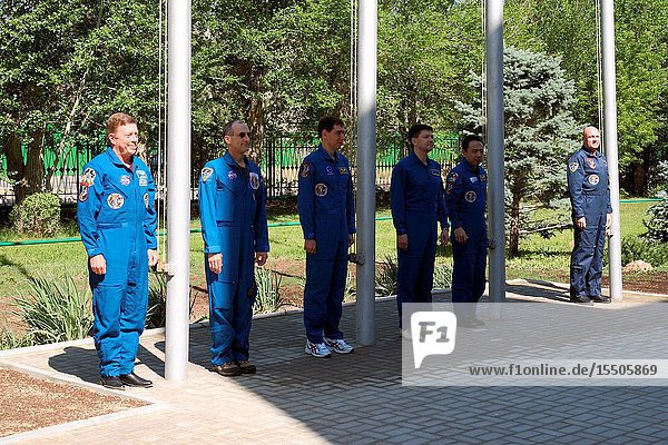 At the Cosmonaut Hotel crew quarters in Baikonur Kazakhstan the Expedition 28 prime and backup crew members participate in the traditional flag raising ceremony May 27 2011 as part of their preparations leading to launch of NASA astronaut Mike Fossum flight engineer Russian cosmonaut Sergei Volkov Soyuz commander and flight engineer and Japan Aerospace Exploration Agency astronaut Satoshi Furukawa flight engineer on June 8 (Kazakhstan time) on the Soyuz TMA-02M spacecraft to the International Space Station. From left to right are Fossum and his backup NASA's Don Pettit Volkov and his backup Oleg Kononenko and Furukawa and his backup Andre Kuipers of the European Space Agency.Victor Zelentsov
