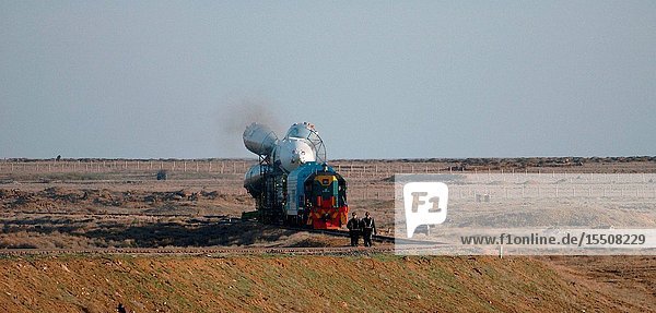 The Soyuz TMA-4 capsule and its booster rocket roll to the launch pad at the Baikonur Cosmodrome in Kazakhstan on April 17,  2004,  in preparation for the launch of the Expedition 9 crew and a European researcher to the International Space Station (ISS) April 19. The Soyuz vehicle is transported to the launch pad horizontally on a railcar from its processing hangar in a process that takes about 2.5 hours to complete. Photo Credit: NASABill Ingalls