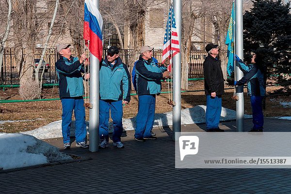 At their Cosmonaut Hotel crew quarters in Baikonur Kazakhstan the Expedition 3940 crew members raise the flags of Russia the United States and Kazakhstan March 15 in traditional ceremonies that are part of crew training. From left to right are Soyuz Commander Alexander Skvortsov and Flight Engineer Oleg Artemyev of the Russian Federal Space Agency (Roscosmos) Flight Engineer Steve Swanson of NASA and backup crew members Alexander Samokutyaev and Elena Serova of Roscosmos. Swanson Skvortsov and Artemyev are scheduled to launch to the International Space Station March 26 (Kazakh time) for the start of a six-month mission. Photo credit: NASAVictor Zelentsov