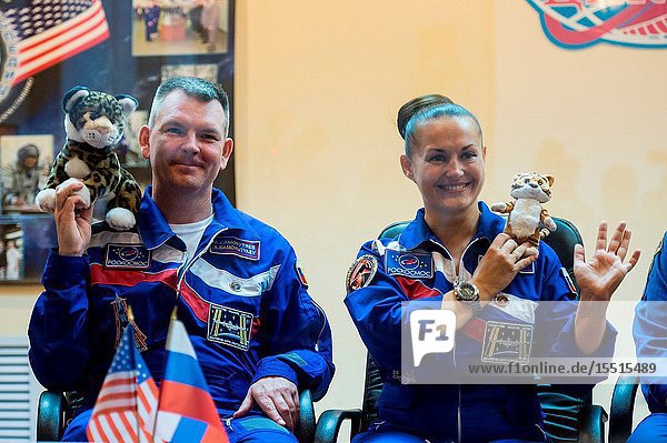 Expedition 41 Soyuz Commander Alexander Samokutyaev of the Russian Federal Space Agency (Roscosmos) and Flight Engineer Elena Serova of Roscosmos hold up tiger toys that will be carried with them to the International Space Station to commemorate International Tiger Day at a press conference held at the Cosmonaut Hotel in Baikonur  Kazakhstan on Sept. 24  2014. The mission is set to launch Sept. 26  Kazakh time  from the Baikonur Cosmodrome.Aubrey Gemignani