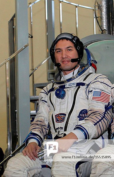 At the Gagarin Cosmonaut Training Center in Star City Russia Expedition 4243 backup Flight Engineer Kjell Lindgren of NASA answers questions from reporters in front of a Soyuz simulator October 30 as part of his final qualification exams for flight. He along with Oleg Kononenko of the Russian Federal Space Agency (Roscosmos) and Kimiya Yui of the Japan Aerospace Exploration Agency (not pictured) are the backups to the prime crew Terry Virts of NASA Anton Shkaplerov of Roscosmos and Samantha Cristoforetti of the European Space Agency --- who are in the final stages of training for launch November 24 Kazakh time in the Soyuz TMA-15M spacecraft to begin a five and a half month mission on the International Space Station.