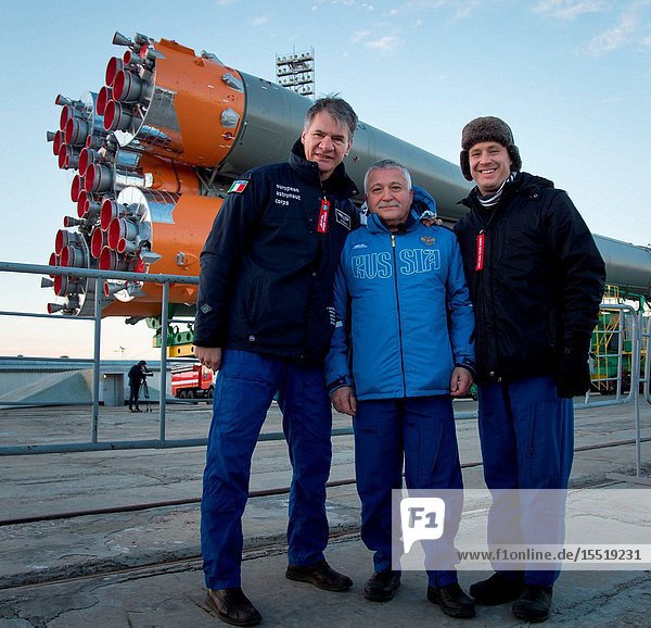 Expedition 50 backup crew members ESA astronaut Paolo Nespoli  left  Russian cosmonaut Fyodor Yurchikhin of Roscosmos  center  and NASA astronaut Jack Fischer pose for a photograph as the Soyuz rocket is rolled out by train to the launch pad at the Baikonur Cosmodrome  Kazakhstan  Monday  Nov. 14  2016. NASA astronaut Peggy Whitson  Russian cosmonaut Oleg Novitskiy of Roscosmos  and ESA astronaut Thomas Pesquet will launch from the Baikonur Cosmodrome in Kazakhstan the morning of November 18 (Kazakh time.) All three will spend approximately six months on the orbital complex. Photo Credit: (NASABill Ingalls)
