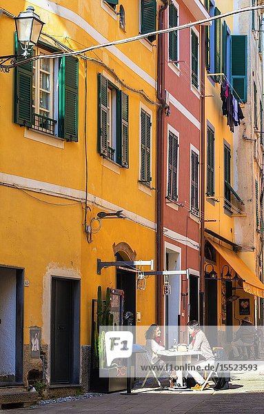Couple eating out in the village of Monterosso al Mare Cinque Terre Liguria Italy Europe.