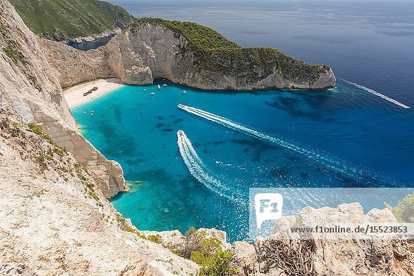Boat wakes in the Ionian sea at Shipwreck beach Zakynthos Ionian Islands Greece Europe.