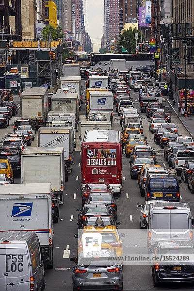 Vehicles clog Tenth Avenue in New York on Tuesday July 2 2019 as they attempt to enter the Lincoln Tunnel during the Great Fourth of July Getaway. A truck crashing over a guardrail on the New Jersey side of the tunnel has completely snarled traffic for hours. (© Richard B. Levine).