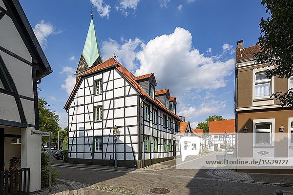 Herten Westerholt Germany North Rhine-Westphalia NRW Westphalia Ruhr area D-Herten D-Herten-Westerholt Old Village Westerholt Alte Freiheit Westerholt half-timbered houses at the Apostelstrasse and catholic church Saint Martinus