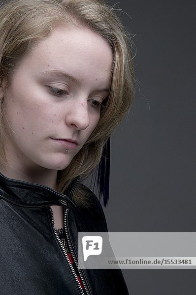Young woman looking wistful UK.