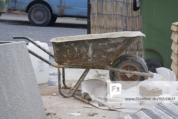 Cement wheelbarrow during building work