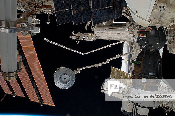 In the grasp of the station's Canadarm2 the Tranquility module is transferred from its stowage position in space shuttle Endeavour's (STS-130) payload bay to position it on the port side of the Unity node of the International Space Station. Tranquility was locked in place with 16 remotely-controlled bolts.