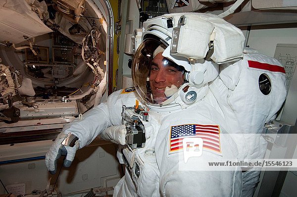 NASA astronaut Chris Cassidy Expedition 36 flight engineer is pictured in the Quest airlock of the International Space Station as he prepares for the start of a session of extravehicular activity (EVA) with European Space Agency astronaut Luca Parmitano (out of frame). Cassidy is wearing an Extravehicular Mobility Unit (EMU) spacesuit.