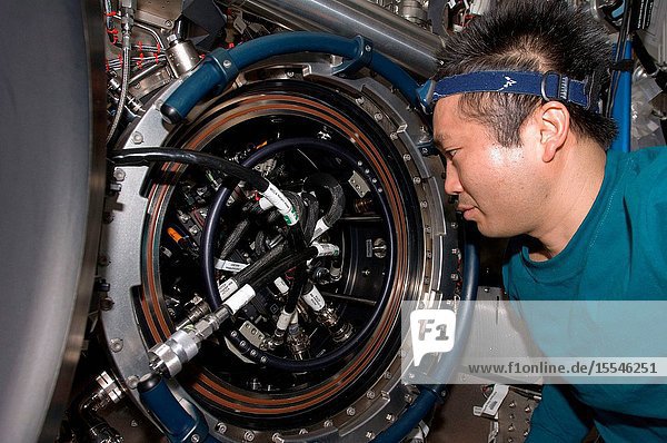 Japan Aerospace Exploration Agency (JAXA) astronaut Koichi Wakata  Expedition 1920 flight engineer  works on the Combustion Integrated Rack (CIR) Multi-user Drop Combustion Apparatus (MDCA) in the Destiny laboratory of the International Space Station. Wakata removed and replaced one fuel reservoir  which required temporary opening the front end cap and removing the fuel supply bypass Quick Disconnect (QD).