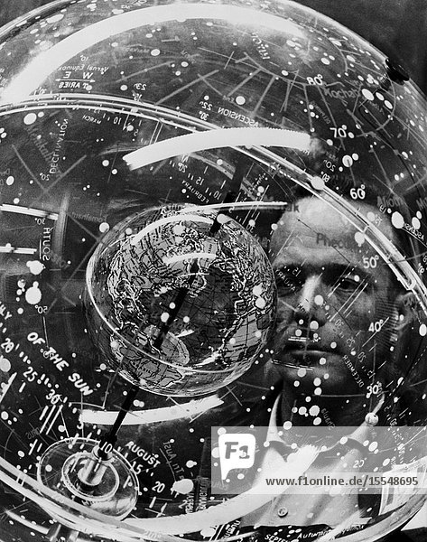 Astronaut M. Scott Carpenter looks into a Celestial Training Device (globe) during training in the Aeromedical Laboratory at Cape Canaveral Florida.