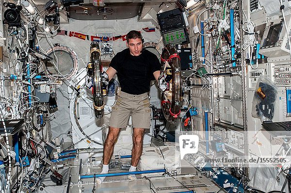 In the International Space Station's Kibo laboratory NASA astronaut Michael Hopkins Expedition 37 flight engineer conducts a session with a pair of bowling-ball-sized free-flying satellites known as Synchronized Position Hold Engage Reorient Experimental Satellites or SPHERES. Surrounding the two SPHERES mini-satellites is ring-shaped hardware known as the Resonant Inductive Near-field Generation System or RINGS. SPHERES-RINGS seeks to demonstrate wireless power transfer between satellites at a distance for enhanced operations.