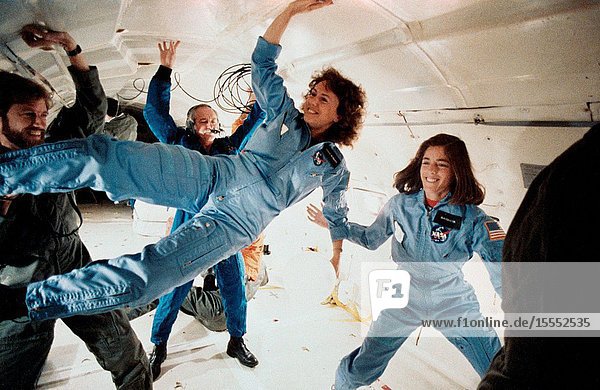 The two representatives of the Teacher-in-Space Project continue their training program at the Johnson Space Center with an additional flight aboard NASA's KC-135 zero gravity aircraft. Sharon Christa McAuliffe left is prime crew payload specialist and Barbara R. Morgan is in training as backup payload specialist. The photo was taken by Keith Meyers of New York Times.
