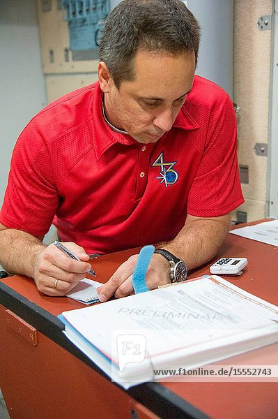 Russian cosmonaut Anton Shkaplerov Expedition 4243 flight engineer participates in an emergency scenario training session in the Space Vehicle Mock-up Facility at NASA's Johnson Space Center.