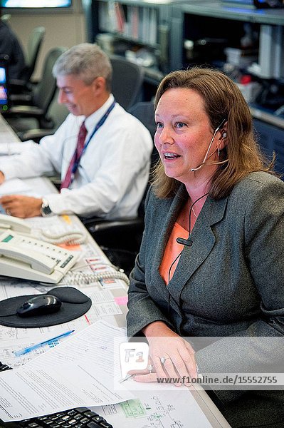 Flight director Dina Contella and astronaut Mark Vande Hei are pictured in the Johnson Space Center's space station flight control room (FCR-1) as the Expedition 38 crew the space community and the rest of world are set to observe the 15th Anniversary of the International Space Station. Contella paid tribute to the anniversary at the exact moment of launch 15 years ago. On Nov. 20 1998 a Russian Proton rocket launched the Zarya module the first piece of the orbital outpost.