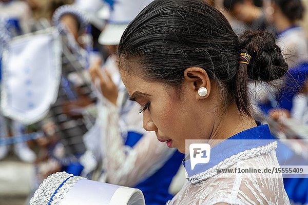 A Filipino Secondary Schoolgirl Gets Ready To Take Part In The Tambor Trumpa Martsa Musika (Drum & Bugle Corps) Contest Dinagyang Festival Iloilo Panay Island The Philippines.