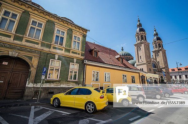 Historical houses on Mitropoliei Street in Historic Center of Sibiu city Romania. View with Romanian Orthodox Holy Trinity Cathedral.