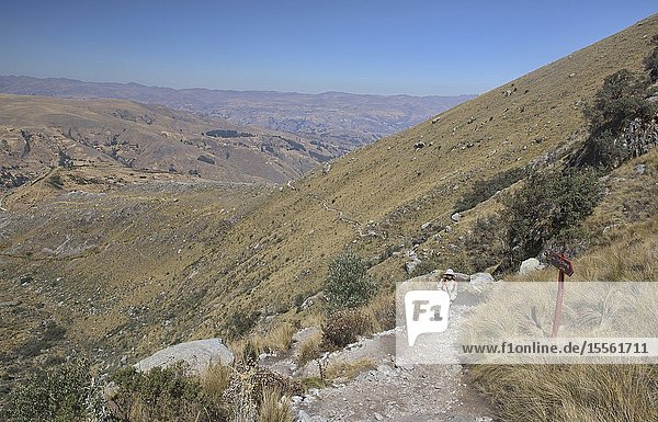 Hiker on the beautiful Laguna Churup trail Huascaran National Park Huaraz Peru.