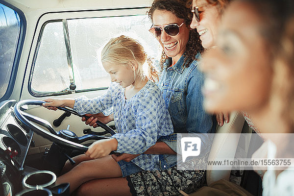Happy multi-generation women in van