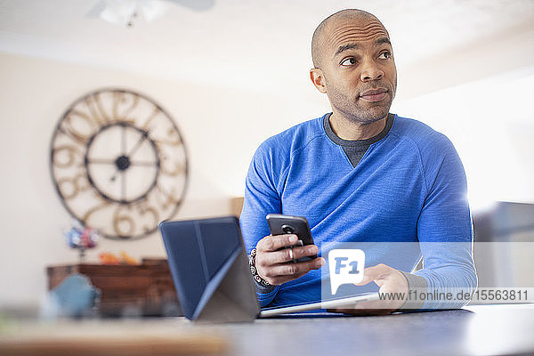 Man using digital tablet and smart phone