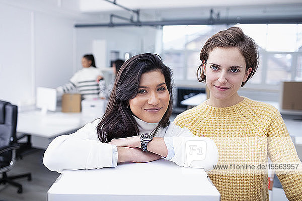 Portrait confident businesswomen in new office