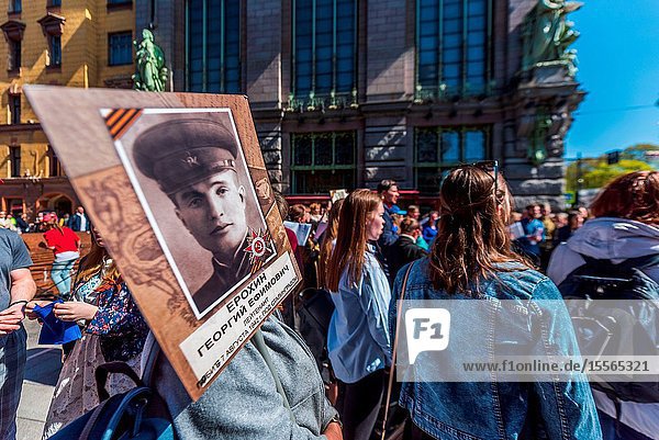 Immortal regiment - people carry banners with a photograph of their warrior ancestors Victory Day Nevsky Prospect St. Petersburg Russia