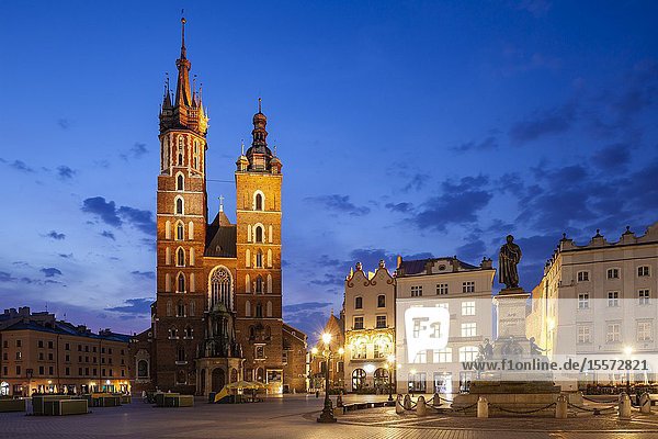 Dawn at St Mary's basilica on the main market Square in Krakow old town Poland.