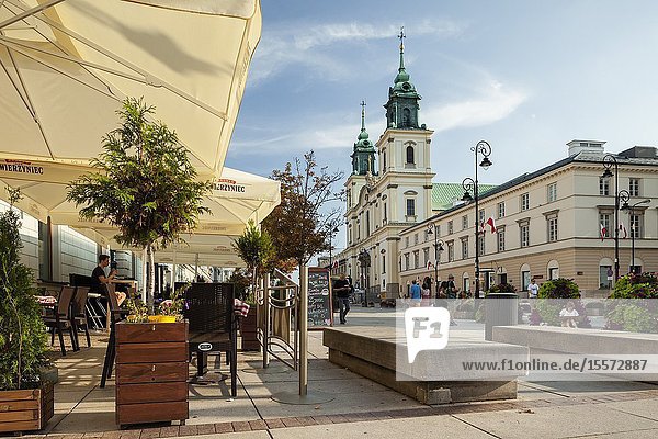 Summer afternoon on Krakowskie Przedmiescie in Warsaw Poland.