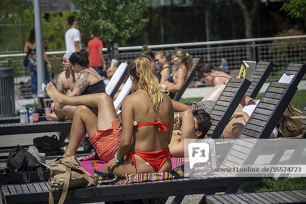 Millennials crowd Domino Park in the Williamsburg neighborhood in Brooklyn in New York to bake in the sun on Sunday  August 4  2019.