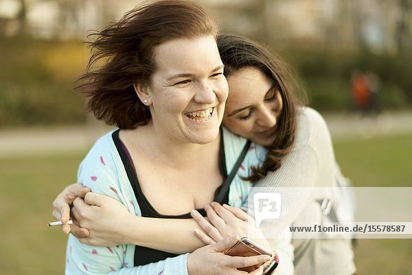 Two friends embracing in Frankfurt Germany