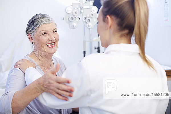 Smiling senior woman at the eye doctor