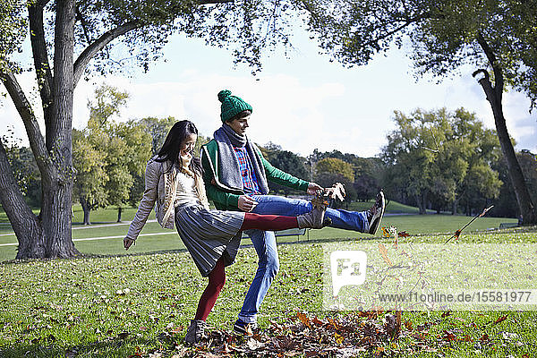 Germany  Cologne  Young couple in park  smiling