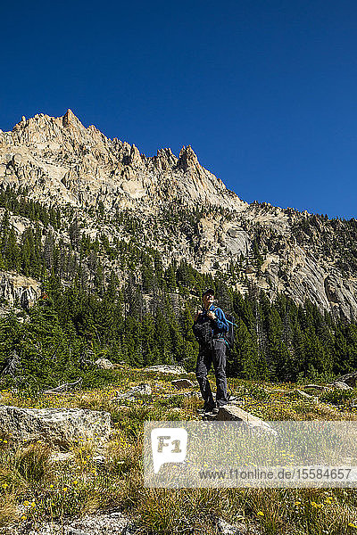 Senior man hiking on Sawtooth Mountains in Stanley  Idaho  USA