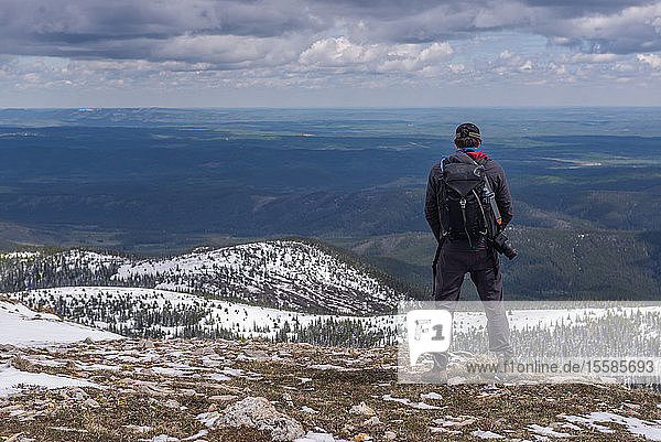 Hiker on top of mountain range Calgary Canada