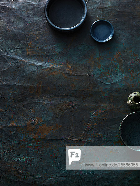 Empty small plates on textured surface