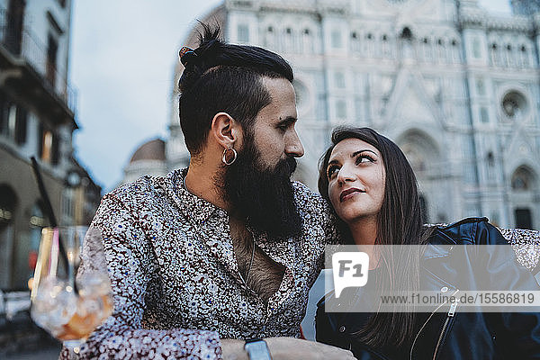 Couple gazing lovingly into each other's eyes in cafe  Santa Maria del Fiore  Firenze  Toscana  Italy