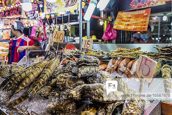Fresh fish market stall at Jalan Alor Night Food Market in Kuala Lumpur  Malaysia  Southeast Asia