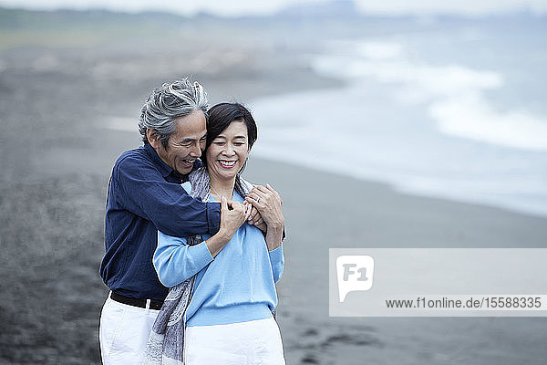 Senior Japanese couple at the beach