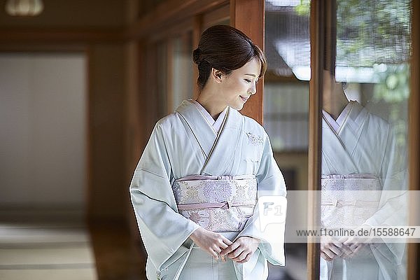 Young Japanese woman wearing traditional kimono
