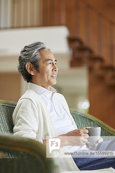 Senior Japanese man at home