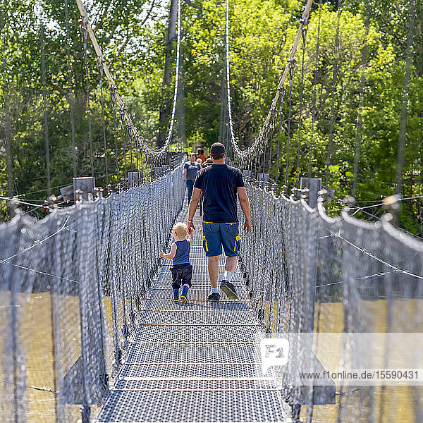 Star Mine Suspension Bridge a 117 metre long pedestrian suspension bridge across the Red Deer River; Drumheller Alberta Canada