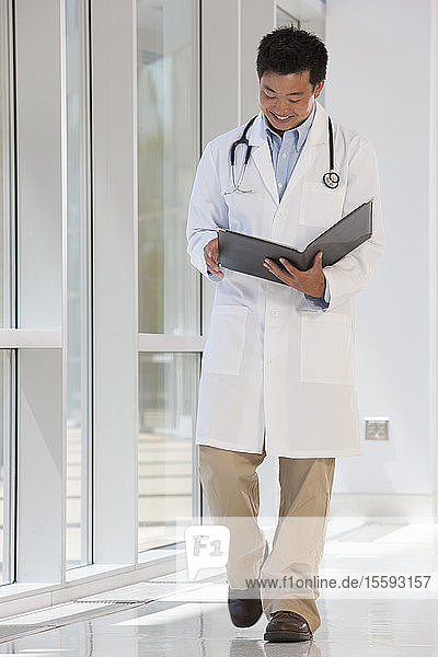 Doctor studying a patient records