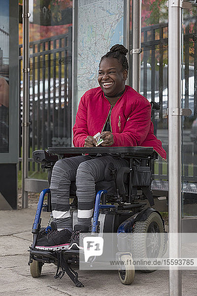 Teen with Cerebral Palsy at bus stop